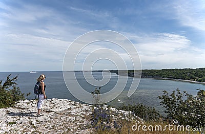 Woman hiking on the beach Stock Photo