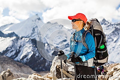 Woman hiking in Himalaya Mountains Stock Photo