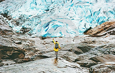 Woman hiking at Nigardsbreen glacier Travel Lifestyle Stock Photo