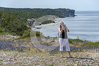Woman hiking on the beach Stock Photo