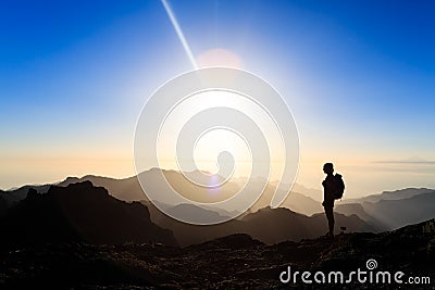 Woman hiking success silhouette in mountains sunset Stock Photo