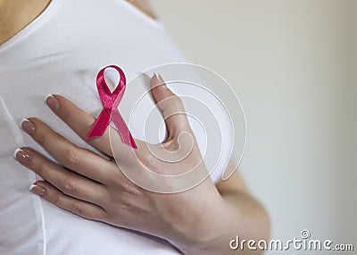 Woman hold her breast and have sign for breast cancer on it Stock Photo