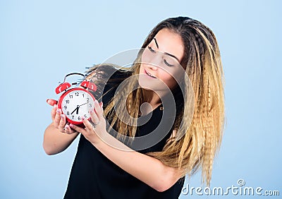 Woman hold vintage alarm clock. Practice of advancing clocks. Daylight saving time. Change time zone. Watch repair. Time Stock Photo