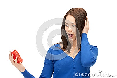 Woman holding alarm clock Stock Photo