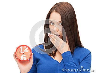 Woman holding alarm clock Stock Photo