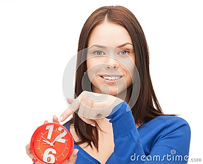 Woman holding alarm clock Stock Photo