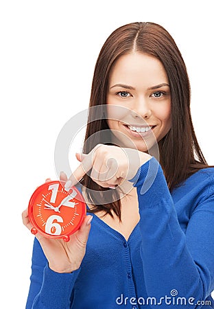 Woman holding alarm clock Stock Photo