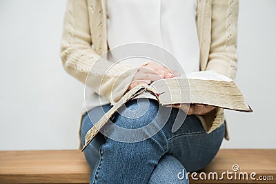 Woman holding bible Stock Photo