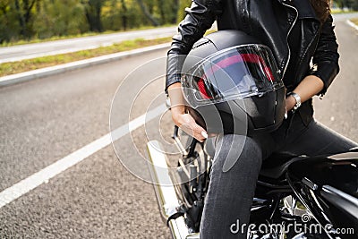 woman holding bike helmet in hands Stock Photo