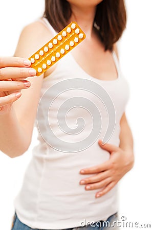 Woman holding birth control pills Stock Photo