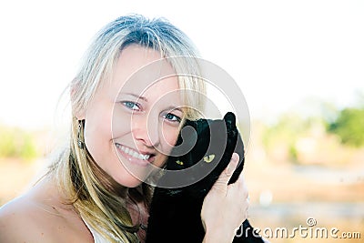 Woman Holding Black Cat Stock Photo