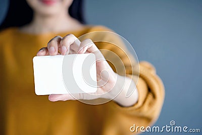 Woman holding blank business card Stock Photo