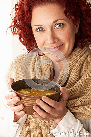 Woman holding bowl of soup Stock Photo