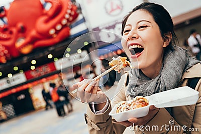 Woman holding box of japanese local street food Stock Photo