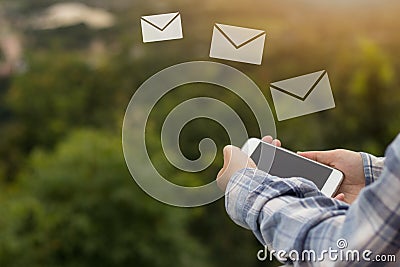 Woman holding cell phone and send e-mail Stock Photo