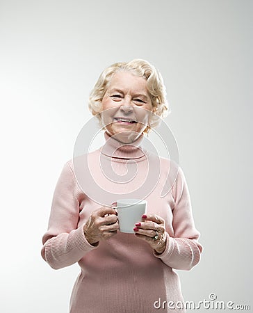 Woman holding coffee cup. Stock Photo