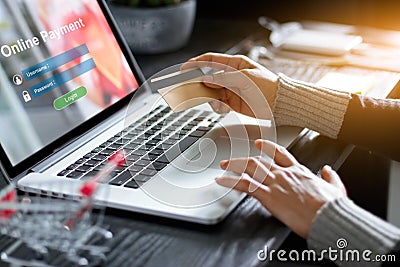 Woman holding credit card and using laptop online payment internet banking. Technology and online shopping concept Stock Photo