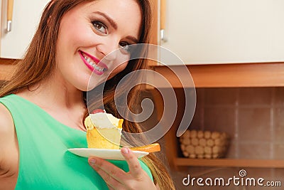 Woman holding delicious sweet cake. Gluttony. Stock Photo