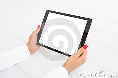 Woman holding digital tablet in horizontal position. Stock Photo