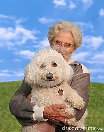 Woman Holding Dog (Focus on Dog) Stock Photo