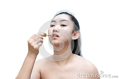 Woman holding a dropper sublingual Cannabis oil Stock Photo