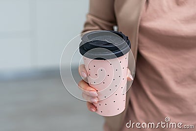 Woman holding elegant thermocup on white background, closeup Stock Photo