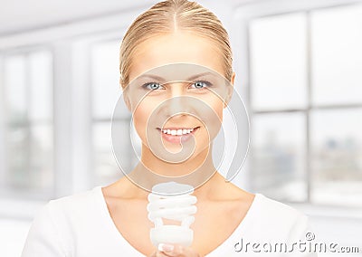 Woman holding energy saving bulb Stock Photo