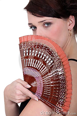 Woman holding a fan Stock Photo