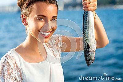 Woman holding fresh fish Stock Photo