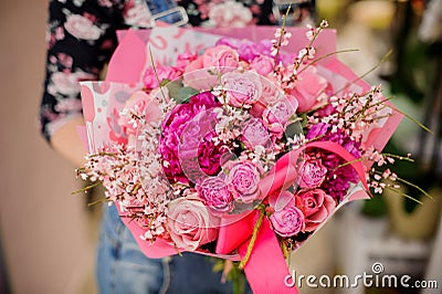 Woman holding a gorgeous flower bouquet in pink tones for Valentines day Stock Photo