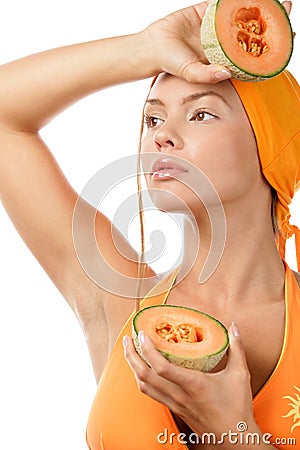 Woman holding halves of cantaloupe Stock Photo