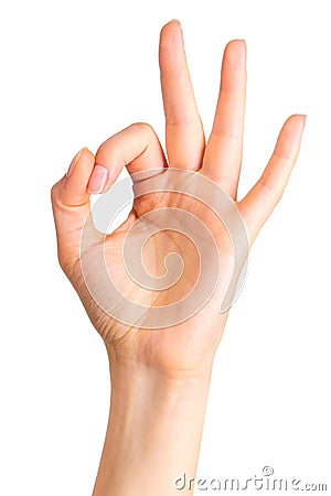 Woman holding hand in gesture of okay or letter O. Sign of success or luck Stock Photo