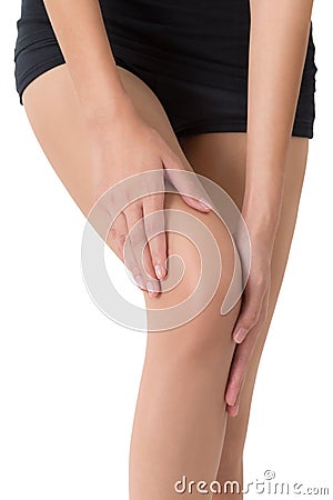 Woman holding her beautiful healthy long leg with massaging knee in pain area. Stock Photo