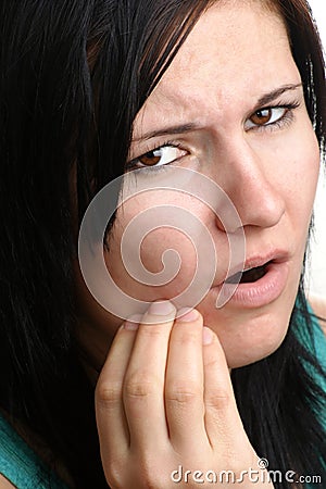 woman holding her painful jawbone Stock Photo
