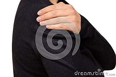 Woman is holding her sore shoulder with her hand. Horizontal isolated photo, medical concept Stock Photo