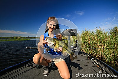 Woman Holding Large Mouth Bass Caught Fishing From Boat Editorial Stock Photo