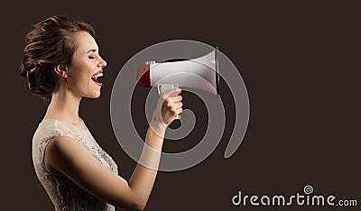 Woman holding megaphone in hand and screaming. Stock Photo