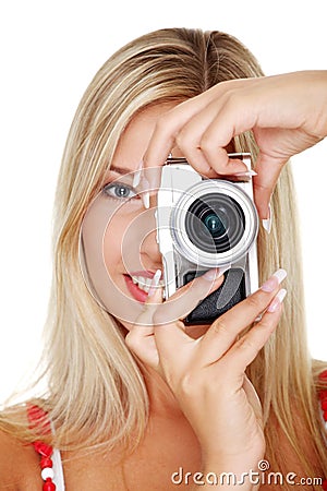 Woman holding a micro four thirds photo camera. Stock Photo