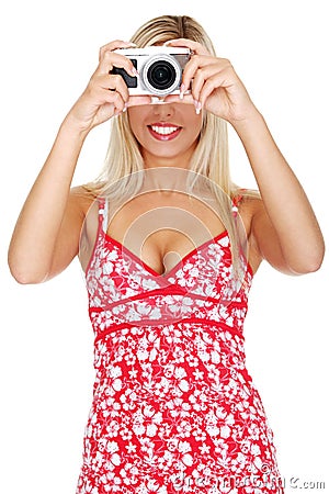 Woman holding a micro four thirds photo camera. Stock Photo