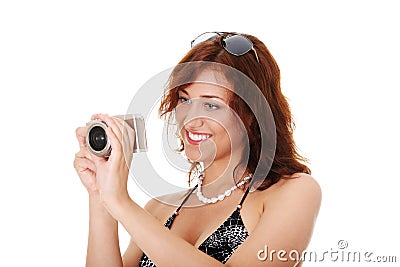 Woman holding a micro four thirds photo camera. Stock Photo