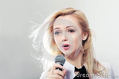 Woman holding microphone Stock Photo