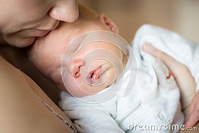 Woman holding newborn baby boy Stock Photo