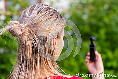 Woman holding osmo camera Stock Photo