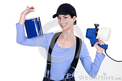 Woman holding paint sprayer Stock Photo