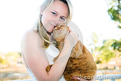 Woman Holding Pet Cat Stock Photo