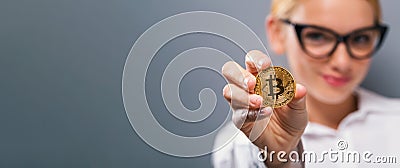 Woman holding a physical bitcoin Stock Photo