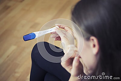 Woman Holding Pregnancy Test Stock Photo