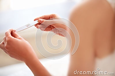 Woman Holding Pregnancy Test. Pregnant Stock Photo
