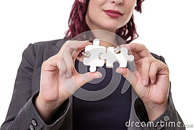 Woman holding puzzle pieces Stock Photo