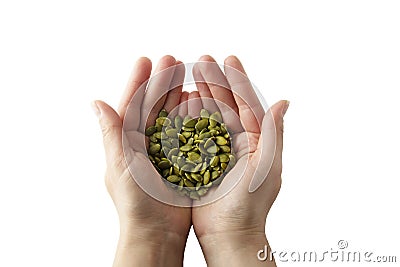 Woman holding raw unshelled pumpkin seeds, closeup view, isolated. Healthy, vegetarian super food or snack. Template for design Stock Photo